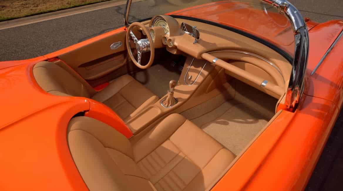 Award-winning 1961 Chevrolet Corvette Custom Rest Mod build with House of Kolor Citric-Hue Tangelo and custom Cream two-tone finish.